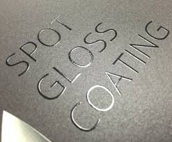Close-up of spot gloss coating on black packaging