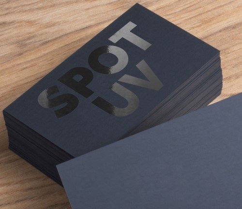 Close-up of spot gloss coating on black packaging