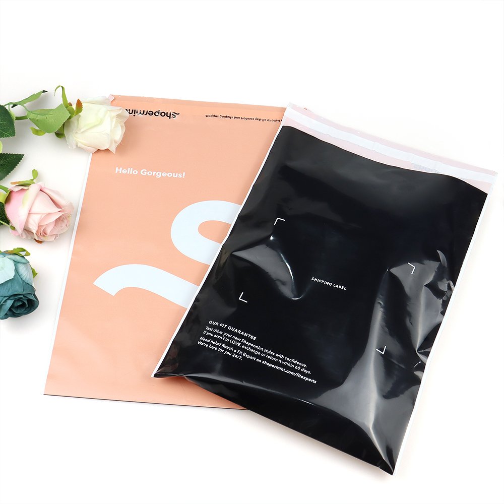 Custom printed poly mailer bags in pink and black from Finer Packaging wholesale.