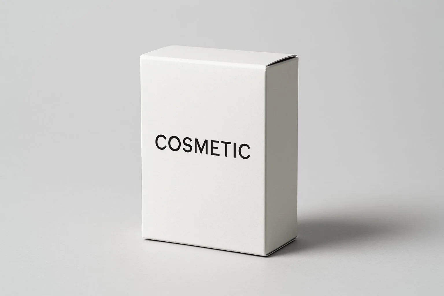 A minimalist white cosmetic box with black, elegant sans-serif typography